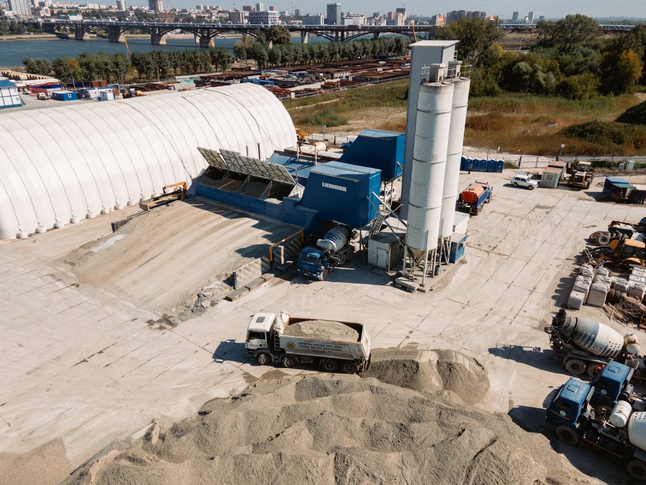 Concrete batching plant and industrial equipment in Novosibirsk, Russia, captured from above.